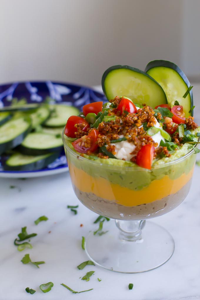 Paleo Vegan Seven Layer Dip is a healthy option for your next party! Mostly raw and completely bean free, this dip is delicious enough to be a meal on it's own!