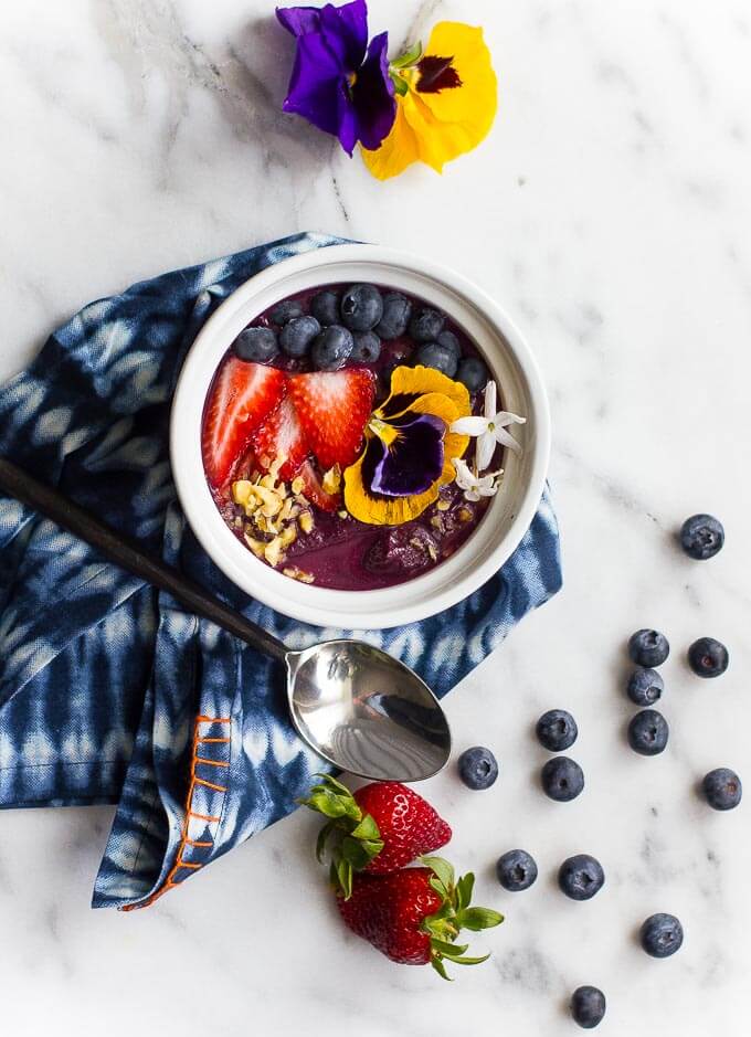 Smoothie bowls are one of the easiest options for a quick and healthy breakfast. All you need is some frozen fruit and your favorite raw toppings! Try this Blueberry Mango Protein Smoothie Bowl {vegan and gluten free}
