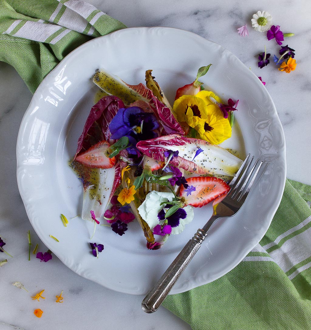 Endive Strawberry and Pansy Salad with lemon poppy seed vinaigrette